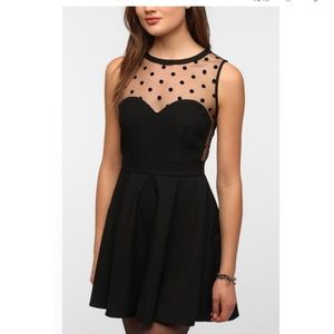 Fit and flare Urban Outfitters polka dot dress with cut out sides and keyhole!